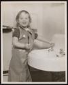 [Girl at sink]