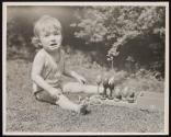 [Child with toy]