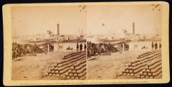 [Soldiers on shore near pier, stacks of cannonballs on right]