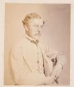 [Portrait of man in light suit]