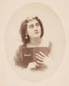 [Woman with book of Tennyson's poems]