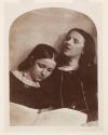 [Two girls with sheet of music]