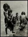 [Children bathing in river]