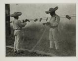 [Men mending nets]