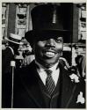[Man in top hat]