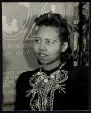 [Lady wearing necklace]