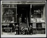 [Children gathered on steps]