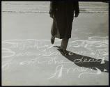 [Person walking on sidewalk graffiti]