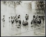 [Children in park sprinkler]