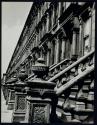 [Angled view of apartment facade]
