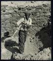 [Man shoveling stones]