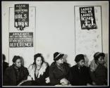 [Women in sitting in line for employment]