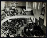 [People inside church listening to sermon]