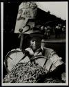 [Man selling beans]
