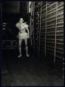 [Dancer behind stage]