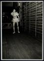 [Dancer behind stage]