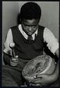 [Boy playing drum]