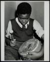 [Boy playing a drum]
