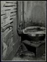 [Toilet on wooden stand]