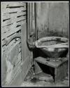 [Toilet on wooden stand]