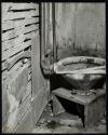[Toilet on wooden stand]