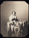 [Seated woman]