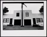 [Stucco building / palm tree]