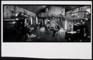 [Elderly woman and another woman (possibly Anne Noggle) seated in wood paneled room]