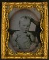 [Child, seated, another's hand is propping head]