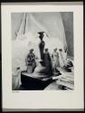 [Still life, statuettes and mail]
