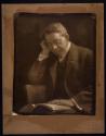 [Man reading book]