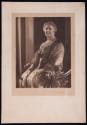 [Seated woman]