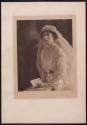 [Seated bride holding Bible]