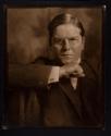 [Man in glasses \ woman holding book]