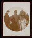[Man, woman, girl, standing (from behind)]