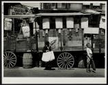 [Boys and produce carts]