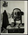 [Man reflected in mirror]