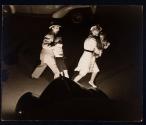 [Advertising: startled family crossing street in front of car]