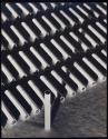 [Design: rows of Raleigh cigarettes and shadows]