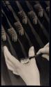 [Hand and toothbrushes]