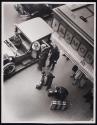 [View from above, couple arriving with luggage at St. Moritz Hotel]