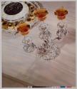 [Three Feathers [liquor], three Manhattans on candelabra]