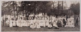 [Group posed outdoors, possibly a family picnic]