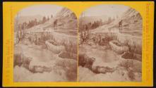 Figure standing among springs - Yellowstone Basin