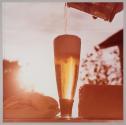[Still life with beer and crackers at sunset]