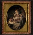 [Postmortem of child seated in a chair]