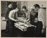 [Sealtest Ice Cream: Victor Keppler and assistants sorting berries onto plates in studio kitchen]