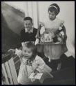 [Hallmark Cards, 3 children carrying breakfast and cards upstairs]