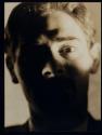 [man's face, mostly in shadow]
