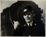 [train conductor in front of train engine]